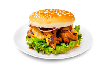 Burger, hamburger with chicken breast, pineapple, tomato and lettuce on a plate. Isolated.