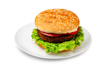 Burger, hamburger with vegan cutlet, tomato and lettuce on a plate. Isolated.