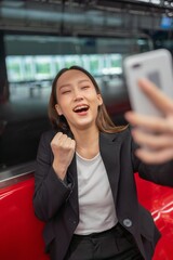 Young businesswoman video call and selfie in the sky train