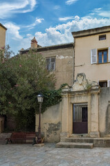 Fototapeta na wymiar Nonza in Corsica, houses in the village, in a typical street 