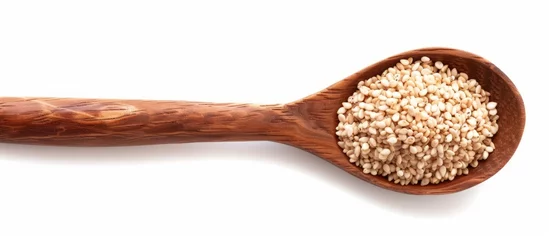 Fotobehang Wooden spoon with organic sesame seeds isolated on white background, containing nut butter or tahini made from sesame paste. © 2rogan