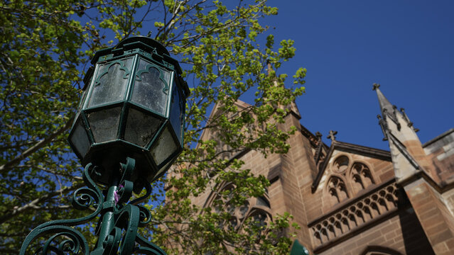 old street lamp in front of a church