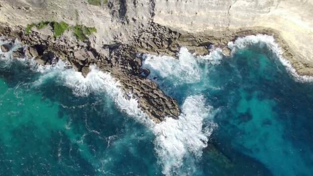 Above View Of Turquoise Waters Breaking On Rugged Cliffs In Porte d`Enfer, Guadeloupe France. Aerial Shot 