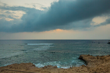 dark stormy rain clouds at the beach in egypt