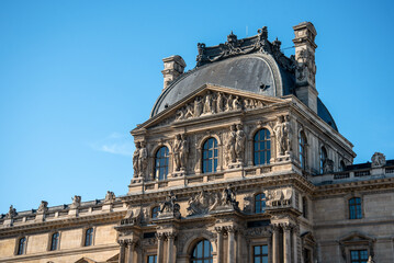 Fototapeta na wymiar Detail of the left wing facade of Louvre Palace