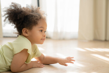 Fototapeta premium Little African American girl playing freedom at home. the child playing high-quality photo