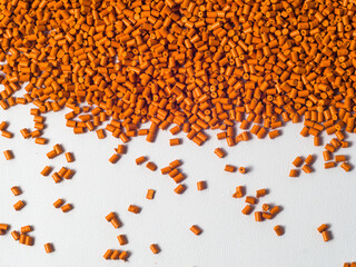pearl gold masterbatch granules on a white background, this polymer is a product colorant for...