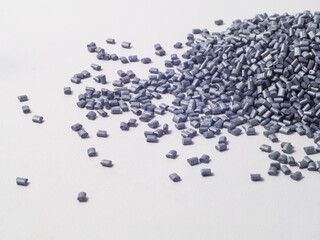 pearl silver masterbatch granules on a white background, this polymer is a colorant for products in the plastics industry