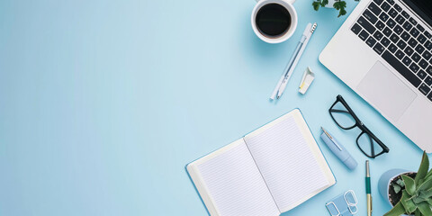 top view white book and accounting on a minimal clean light blue desk with laptop