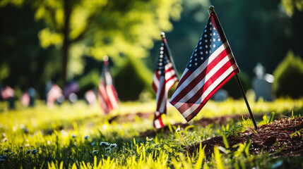 American flag on the grave in the cemetery. Memorial day concept.