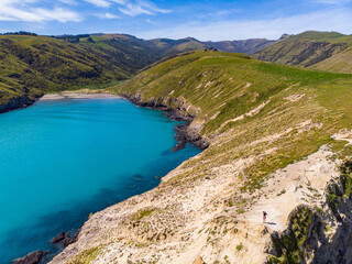 aerial panorama of tumbledown bay, banks peninsula near christchurch, canterbury, new zealand south...