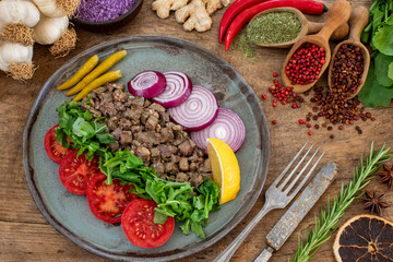 Roasted Albanian liver with onion and arugulas. Ciğer kavurma or ciger tava 