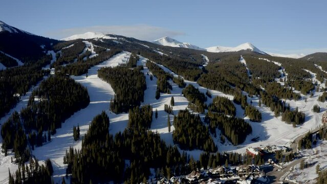 Aerial Drone Copper Mountain Colorado Ikon Epic Pass winter spring sunny first light sunrise morning sunset half pipe chairlift ski runs east village Vail Pass cinematic slowly circle right motion