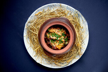 Stewed potatoes with meat in a pot. Ukrainian cuisine.