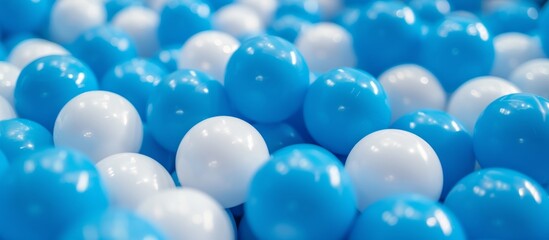 Fototapeta na wymiar White and blue plastic balls selected for a ball pit.