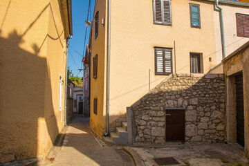 Fototapeta na wymiar A quiet residential road in the Stari Grad historic centre of the coastal town of Novi Vinodolski, Primorje-Gorski Kotar County, Croatia