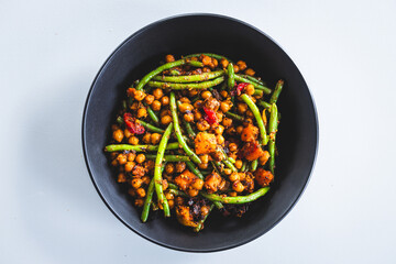 warm chickpea salad with green beans bell pepper and pumpkin, plant-based healthy food