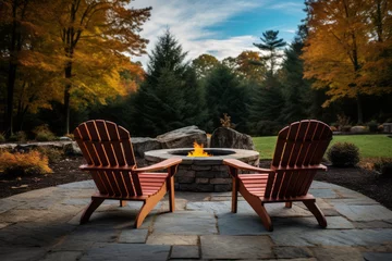 Fotobehang Cozy autumn backyard with fire pit and adirondack chairs © Robert Kneschke