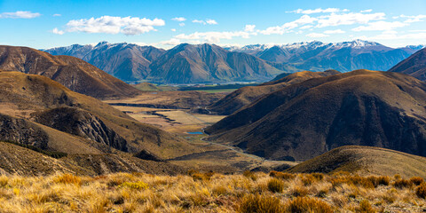 panorama of mountains in torlesse tussocklands national park, canterbury, new zealand south island; trail to trig m with panorama of alps and lake lyndon - obrazy, fototapety, plakaty