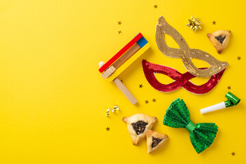 Happy Purim vibe snapshot. From above, top view of triangular pastries, carnival elements like...