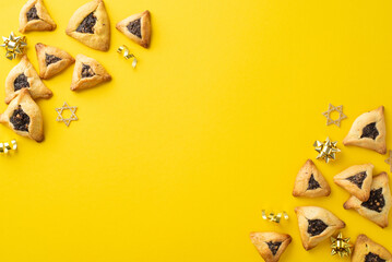 Festive Purim display, top view of tasty hamantaschen, Star of David decorations, gold serpentine,...