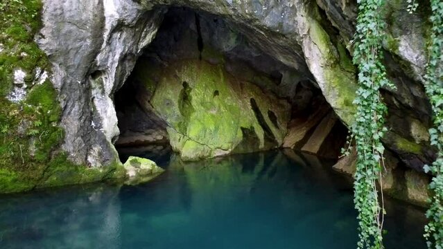 Drone shots of Krupajsko vrelo - Krupaj Spring in eastern Serbia with a beautiful waterfall and a cave in the nature in Balkan country of Serbia  