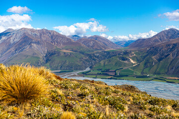 idyllic panorama of lake coleridge, rakaia gorge and alp moutains seen from the top of peak hill in...