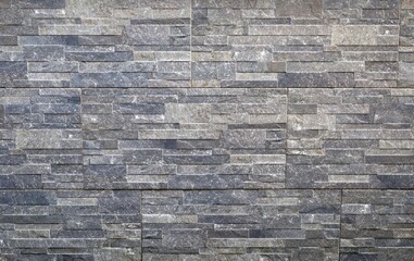 Stone panel coating wall with gray shades colors. Full frame background and texture.