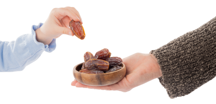 Ramadan concept idea, woman holding wooden plate full of date fruits. Child hand taking one of the palm fruit.  Traditional islamic ramadan, Ramazan fasting image. Transparent png background. - Powered by Adobe
