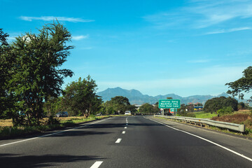 Fototapeta na wymiar Malabacat, Pampanga, Philippines - Jan 14, 2024: Driver's point of view of the NLEX SCTEX interchange highway.