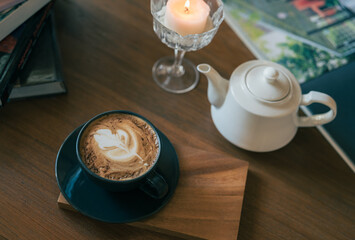 a cup of cappuccino coffee on the table