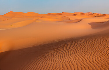 Fototapeta na wymiar Beautiful sand dunes in the Sahara desert with amazing cloudy sky - Sahara, Morocco
