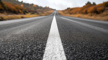 asphalt road and white dividing lines