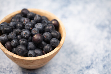 blueberries in a bowl on table