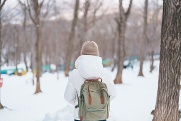 Woman tourist with snow in winter season at Zao fox village, traveler sightseeing Miyagi...