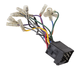 A old car connector or trailer for closing an electrical circuit that a mechanic holds in gloves during repairs.