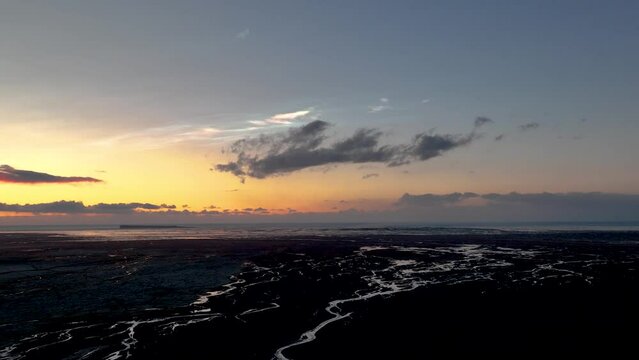 Polar Stratospheric Clouds Spotted In The Sky Over Riverbed In South Iceland. Aerial Wide Shot 