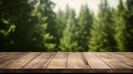 Empty wooden tabletop or terrace for product display with blurred green fir forest background behind. Copy space	
