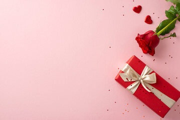 Ultimate surprise for a woman: top view of luxe rose, fashionable gift parcel, heart shapes, and...