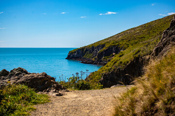 beautiful idyllic coastline alongside the godley head walkaway in christchurch, canterbury, new zealand