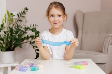 Little girl making homemade slime toy