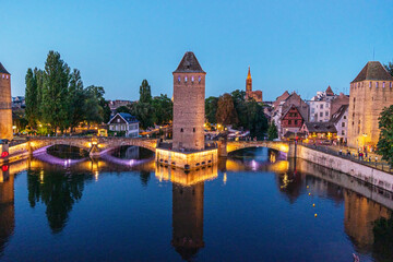 Fototapeta premium Panoramic view on The Ponts Couverts in evening twilight. Strasbourg with blue cloudy sky. France.
