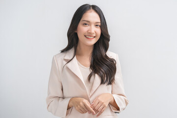 Smiling positive, attractive asian young woman, girl in beige suit formal dress, portrait elegant...