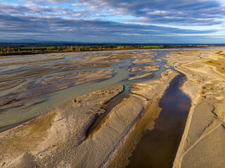 aerial panorama of waimakariri river near christchurch, north canterbury, new zealand; sunset over...