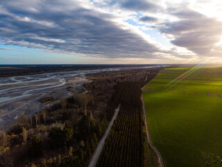 aerial panorama of waimakariri river near christchurch, north canterbury, new zealand; sunset over...