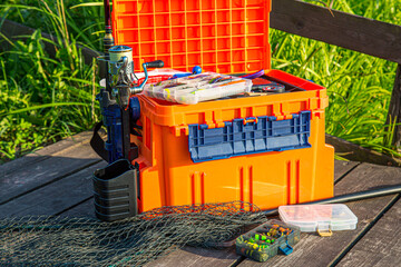 A large fisherman's tackle box fully stocked with lures and gear for fishing.fishing lures and...