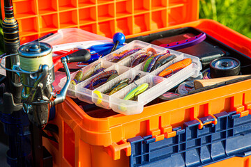 A large fisherman's tackle box fully stocked with lures and gear for fishing.fishing lures and...