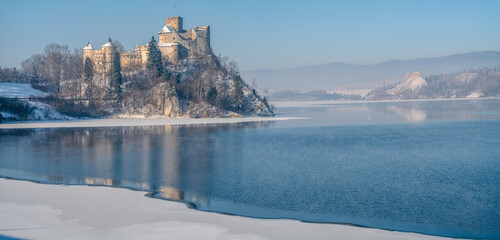 Two castles Niedzica and Czorsztyn in winter scenery,Niedzica,Poland - 729135866