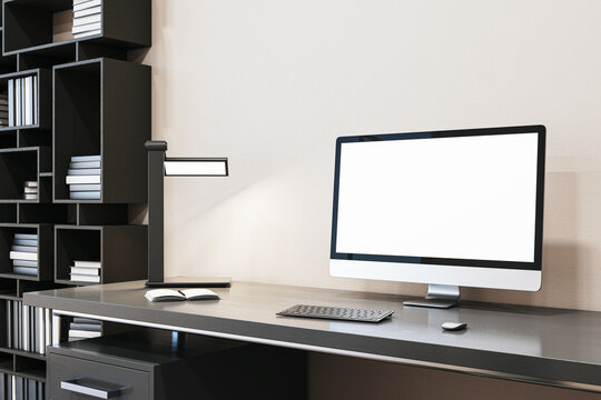 Close up of designer office interior with creative wooden bookcase, empty white computer monitor and other items. Mock up, 3D Rendering.