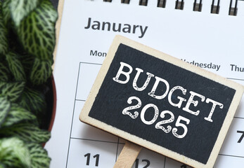 BUDGET 2025 - words on a small chalk board placed on a calendar. Concept for business.